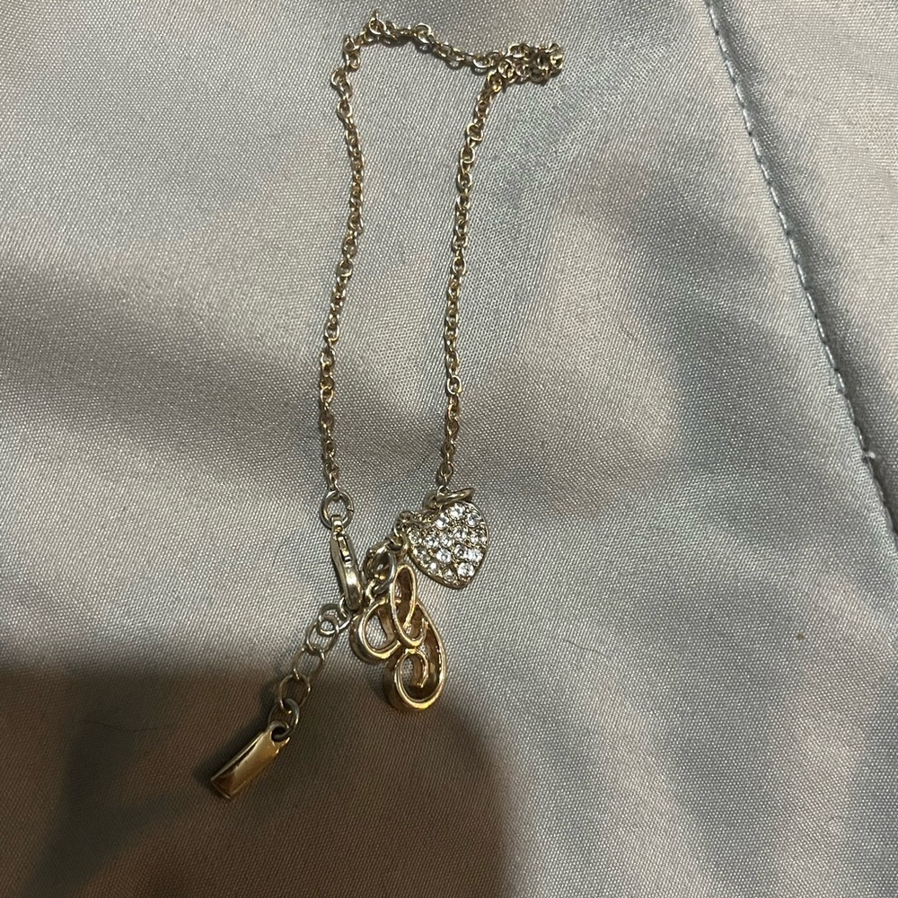 letter “g” and heart bracelet